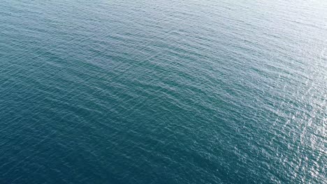 Aerial-top-down-shot-over-Atlantic-ocean-in-Campeche-gulf-along-called-Gulf-of-Mexico-in-Mexico-at-sunrise