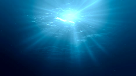 sunlight rays shining through ocean surface. view from underwater. 3d rendered seamless loop animation.