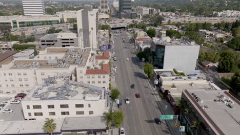 If-you-take-a-bird's-eye-view-of-downtown-Los-Angeles-on-a-clear-day,-you'll-see-an-abundance-of-buildings-and-skyscrapers,-as-well-as-the-bustling-traffic-on-the-roads-below