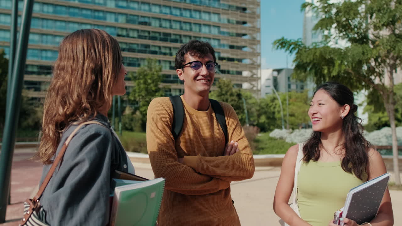 Millennial group of happy students, boys and girls with backpacks, books,