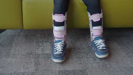 a pair of legs wearing leg braces