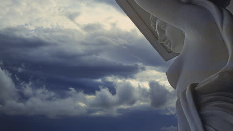 a beautiful french colonial statue of a bare breasted nymph superimposed on a dramatic time lapse sky