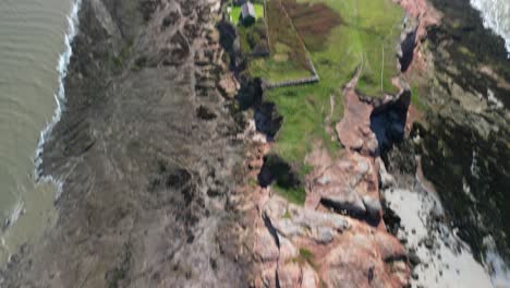 Hilbre-Island,-West-Kirby,-Wirral---aerial-drone-camera-down-reveal-textures