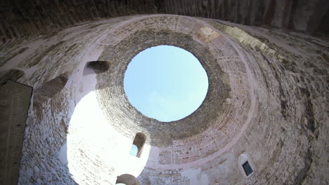 pan from below of hole in dome ceiling at diocletian’s palace in split