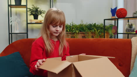 angry dissatisfied shopper child girl kid unpacking parcel feeling upset confused wrong delivery