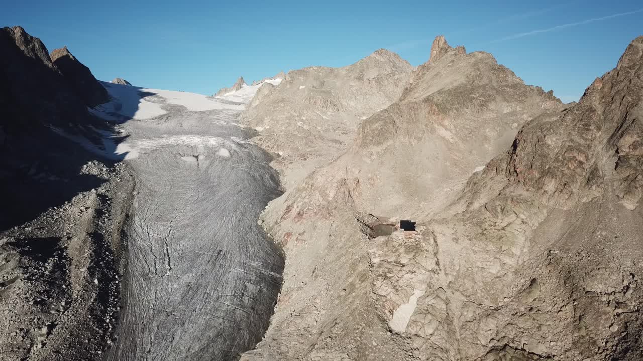 Rocky summits in the alps, Switzerland. Glacier, blue sky. drone aerial view