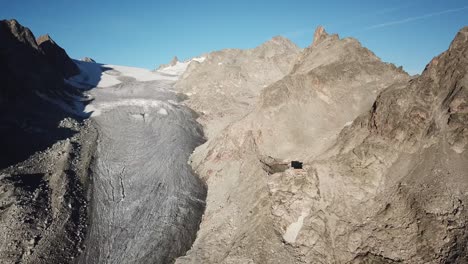 rocky summits in the alps, switzerland. glacier, blue sky. drone aerial view