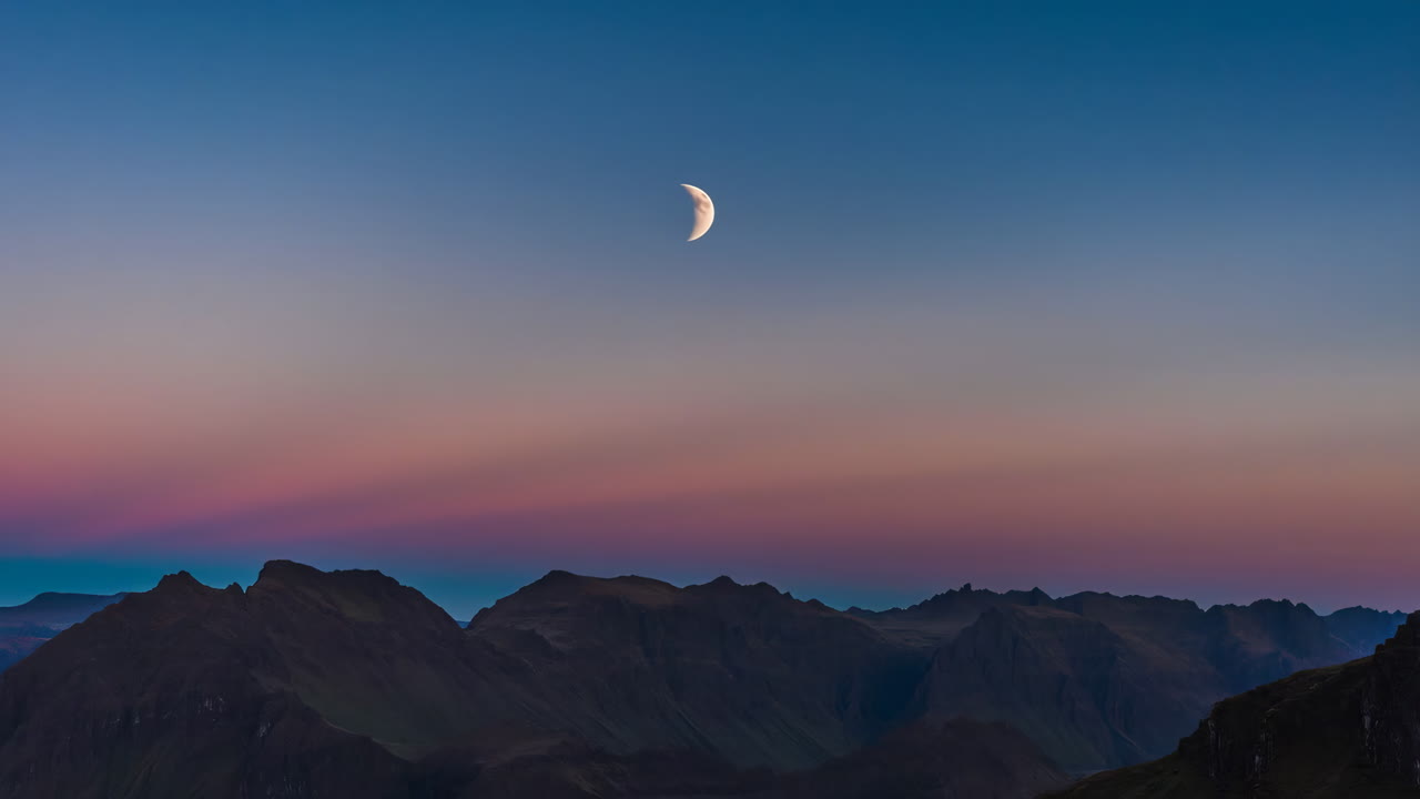 Mountains at dusk under the moon