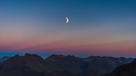 mountains at dusk under the moon