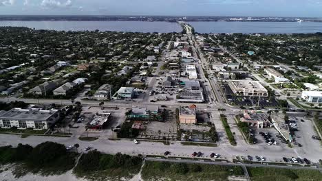 The-City-of-Indialantic-Beach,-Florida-is-seen-from-the-Atlantic-Coastline-with-the-Indian-River-and-Melbourne-Causeway-in-the-Background