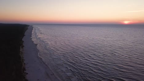 drone footage of a sunset over baltic sea, lubiatowo beach, poland