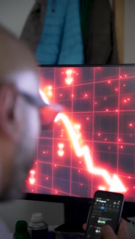 day trader monitoring declining stock prices on computer screen, reacting to market volatility