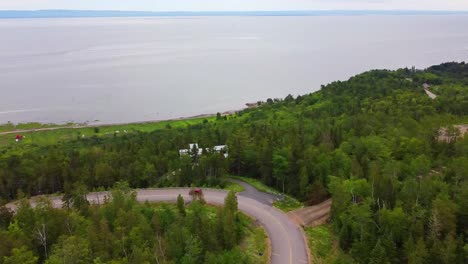 Aerial-footage-of-red-car-on-scenic-route