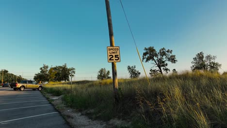 pushing in toward a sign reflecting sunset colors