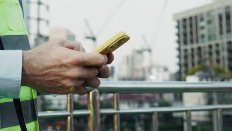 construction worker using mobile phone on site