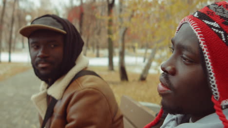 African-American-Men-Sitting-on-Park-Bench-and-Speaking