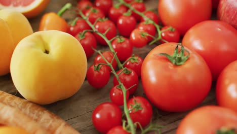 video of fresh fruit and vegetables over wooden background