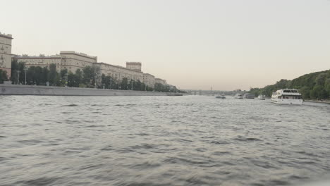 river view with bridge and boats in moscow