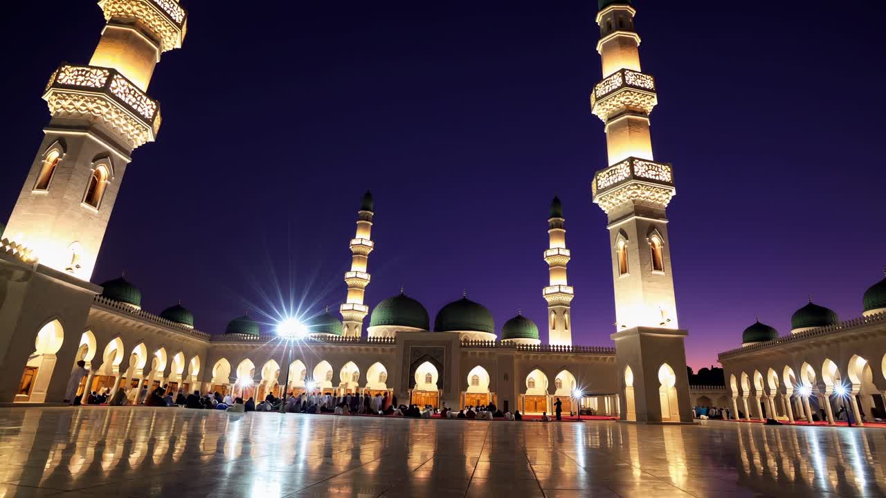 Wide angle shot of muslim people praying in a brightly illuminated mosque at twilight during the holy month of Ramadan, creating a serene and spiritual atmosphere