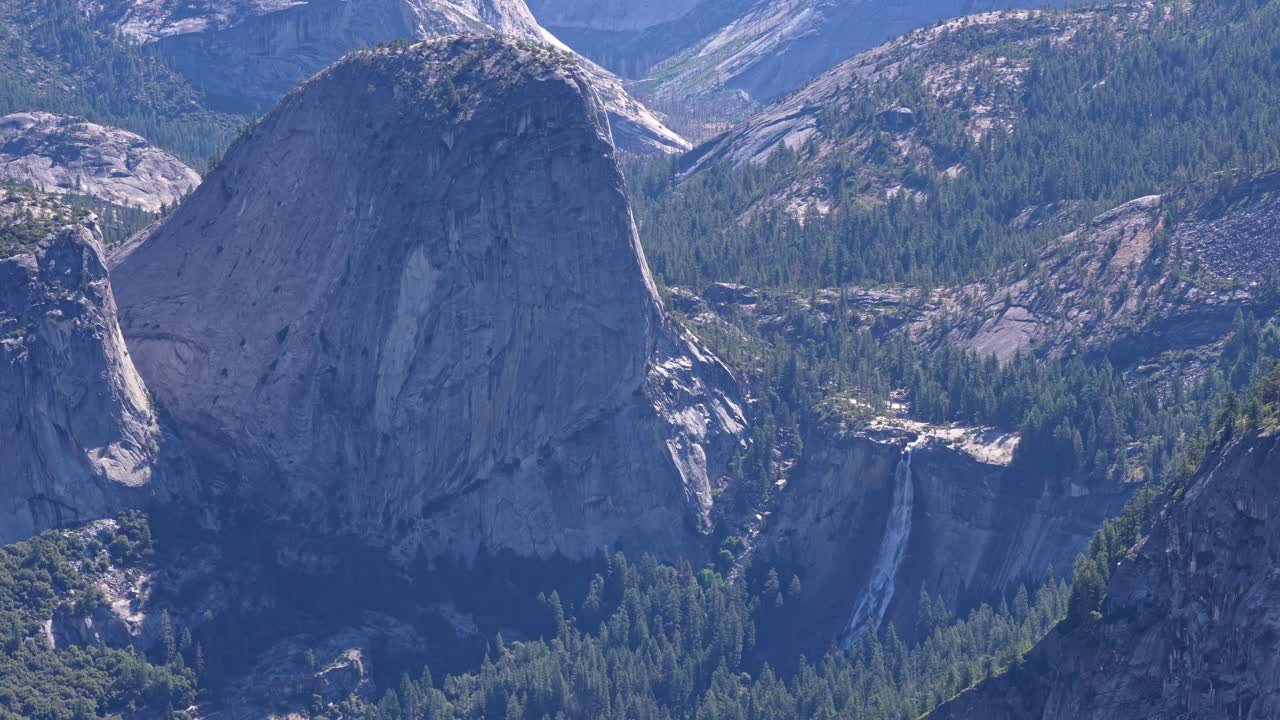 Footage capturing water flowing from Nevada Fall, viewed from an elevated vantage point in Yosemite National Park, California.