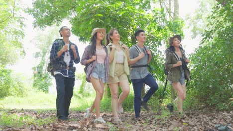 group of friends hiking in a forest