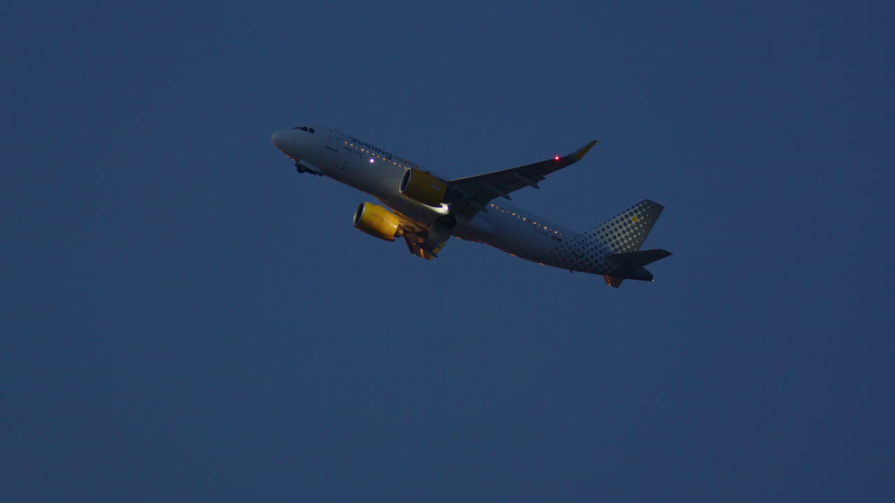 Airplane in Flight at Dusk