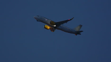 airplane in flight at dusk