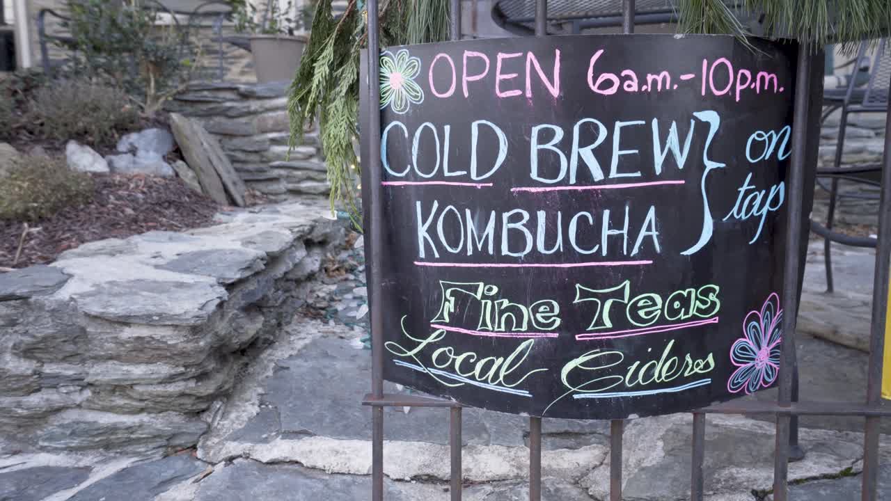 Sign advertising local ciders, cold brew, kombucha, and fine teas