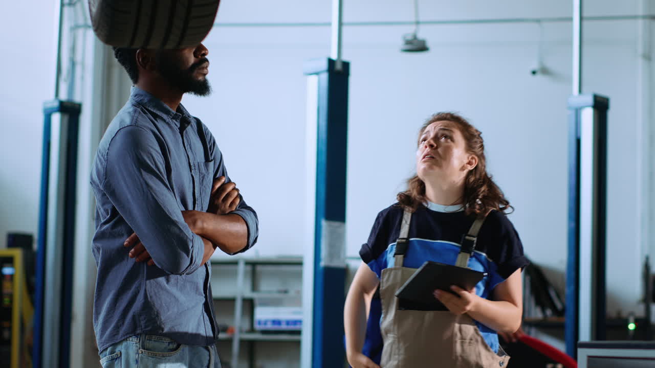 Car expert and man look for new parts