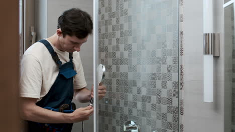 plumber fixing shower head