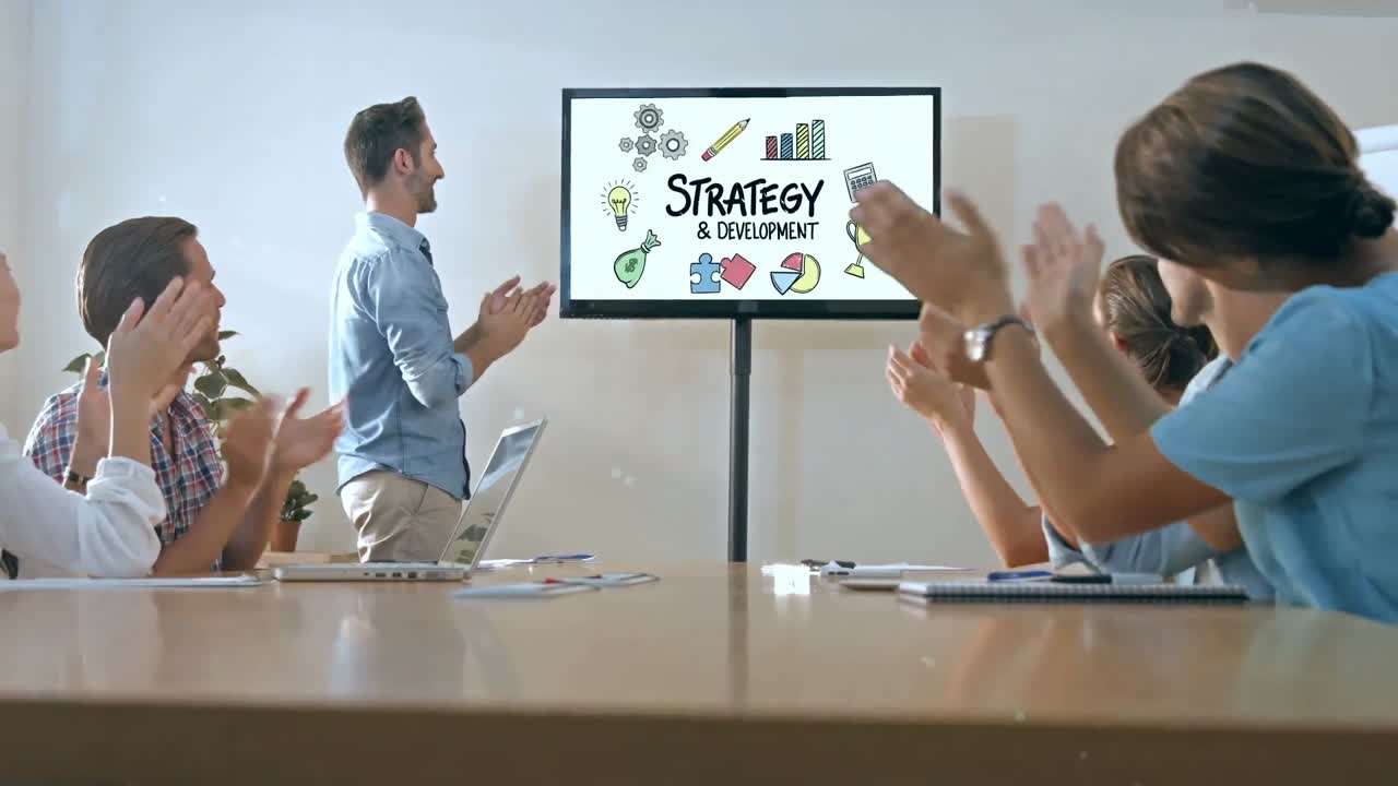 Team of executives clapping at the presentation in the conference room