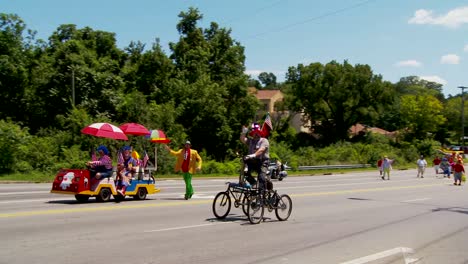 a shriner's parade features clowns on funny cycles