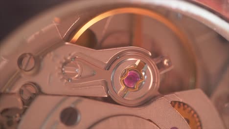 internal structure, gear mechanism inside a beautiful golden vintage clock