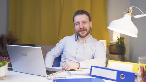 home office worker man looking emotional at camera.