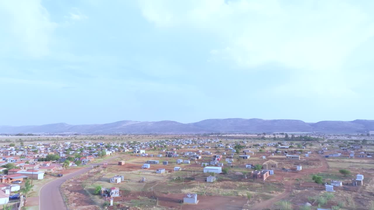 Scattered homes in Mall Of Africa township, Midrand with distant mountain views