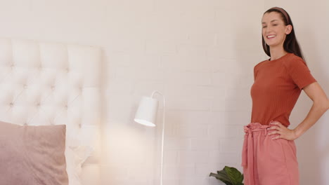 woman adjusting bedside lamp in cozy bedroom, creating relaxing atmosphere