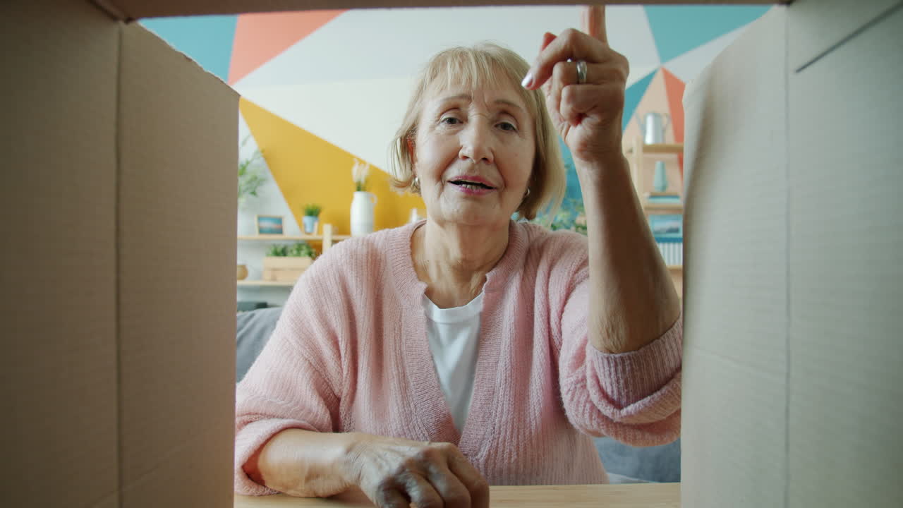 Senior Woman Unboxing and Video Calling