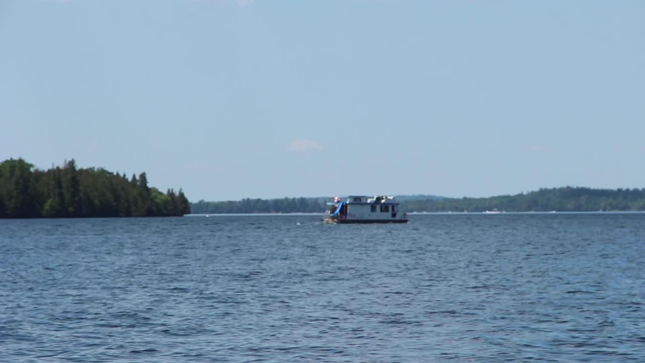 Boating On The Calm Blue Water By The Kawartha Lakes In Ontario, Canada. - wide shot
