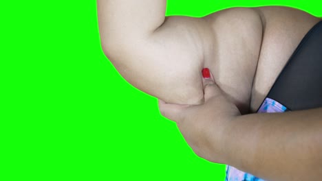 close up of woman touching her flabby upper arm