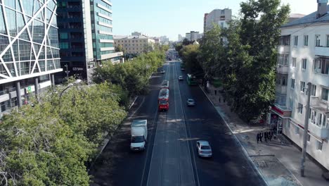 city street with tram and buildings