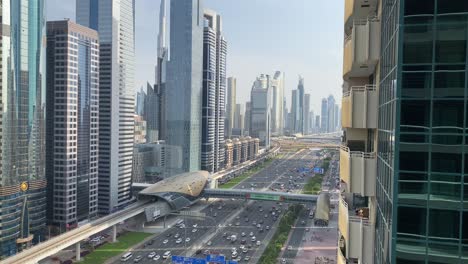 sheikh zayed road in dubai, where a bustling stream of cars flows in both directions