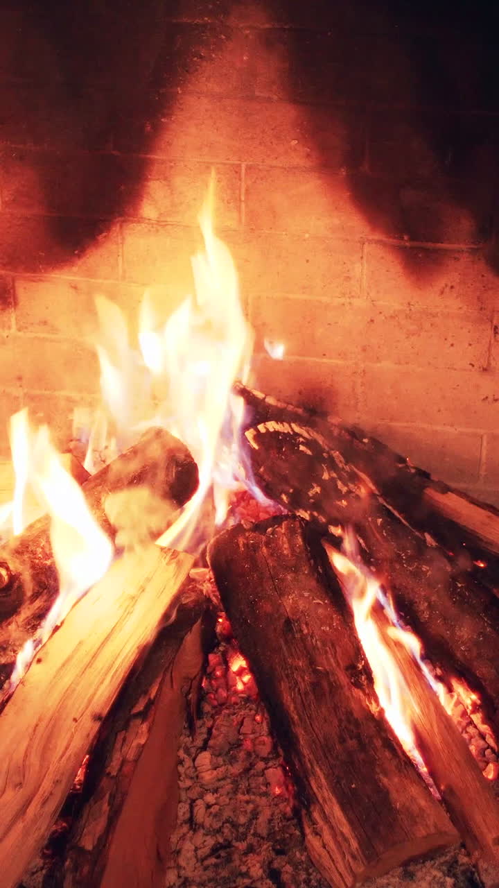 Bright Flames Burning Logs in a Cozy Fireplace
