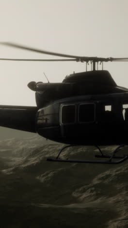 helicopter in flight over mountainous terrain