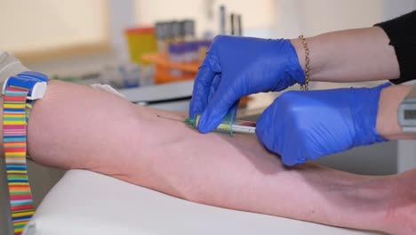 blood sampling in the laboratory. laboratory worker doctor takes a blood sample for analysis. procedure of taking blood in clinic. close-up.