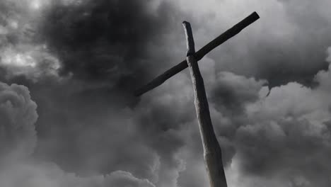 wooden cross pole with storm clouds background