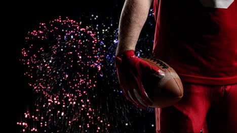 animation of midsection of american football player over fireworks on black background