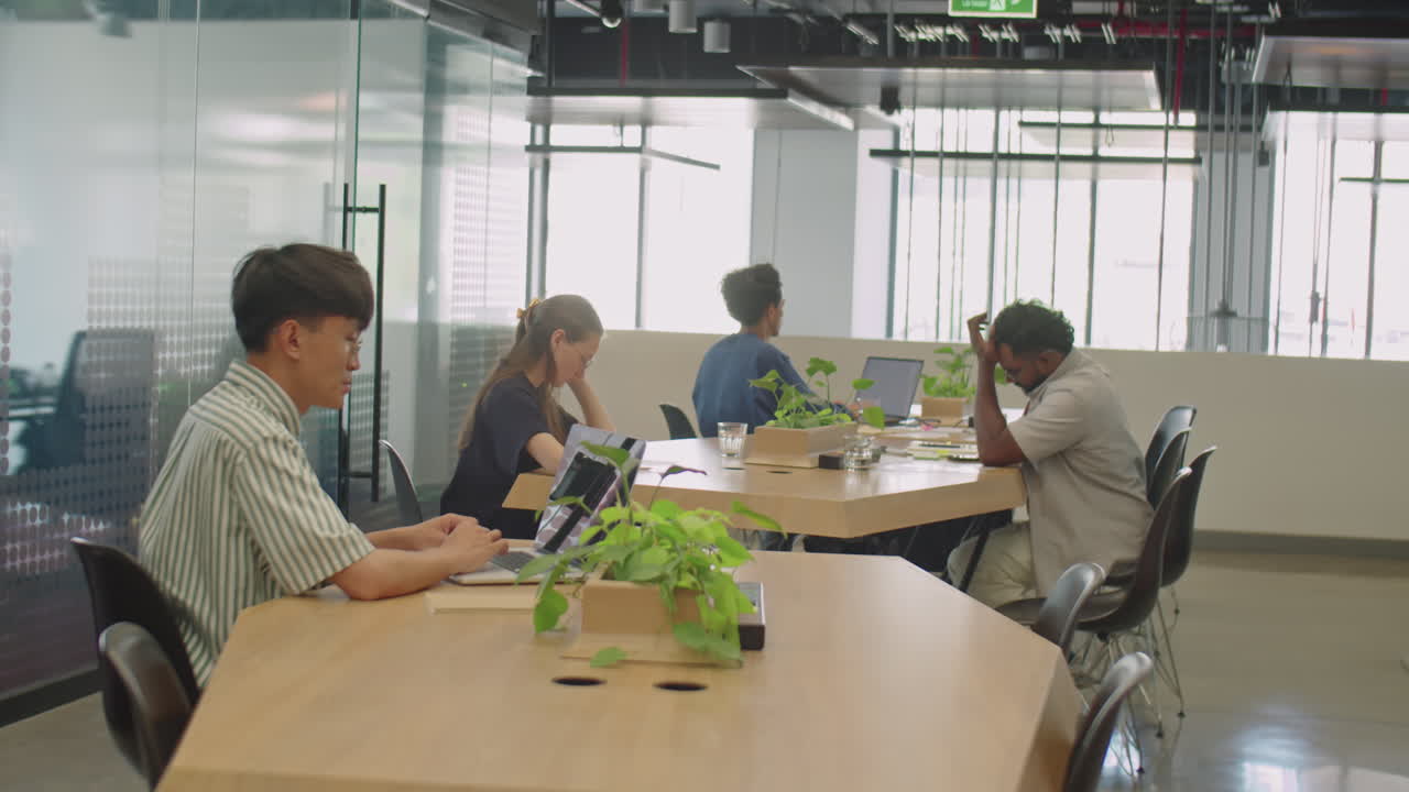 People Working in Modern Coworking Room