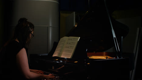 woman playing a piano