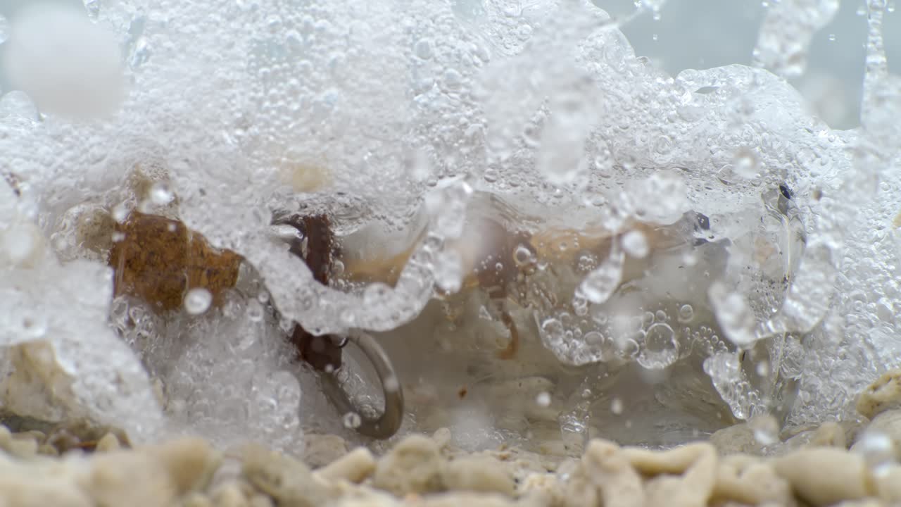 Message in the bottle on a sand beach. Shot on super slow motion camera 1000 fps