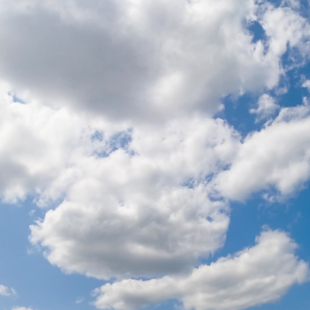 Blue bright weather timelapse. Motion of clouds on the sky